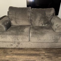 Gray fabric loveseat couch