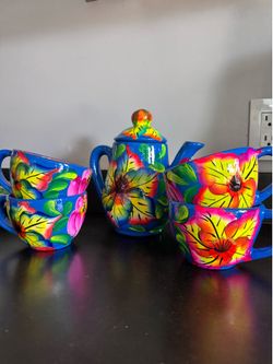 Hand painted clay pitcher set