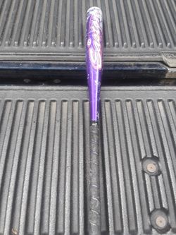Purple Easton Softball bat in good condition.