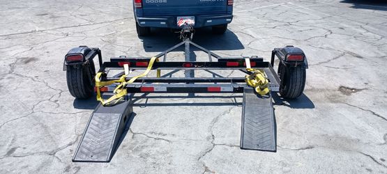 Tow dolly with surge brakes