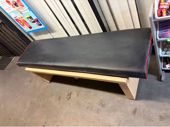 Tan wood sturdy bench with removable cushion topper
