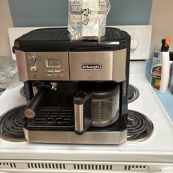 Delonghi  espresso, and coffee maker complete with new filter and descaling solution