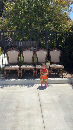 Mathis Home Dinning wood chairs with  beautiful carved gold detail tan brown