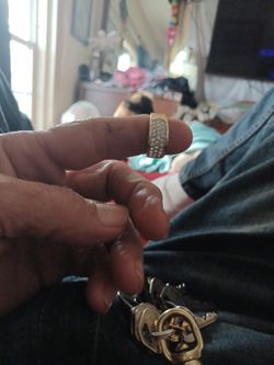 Woman's gold ring with crysthis is.