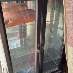 2 Black Wood And Glass Cabinets 