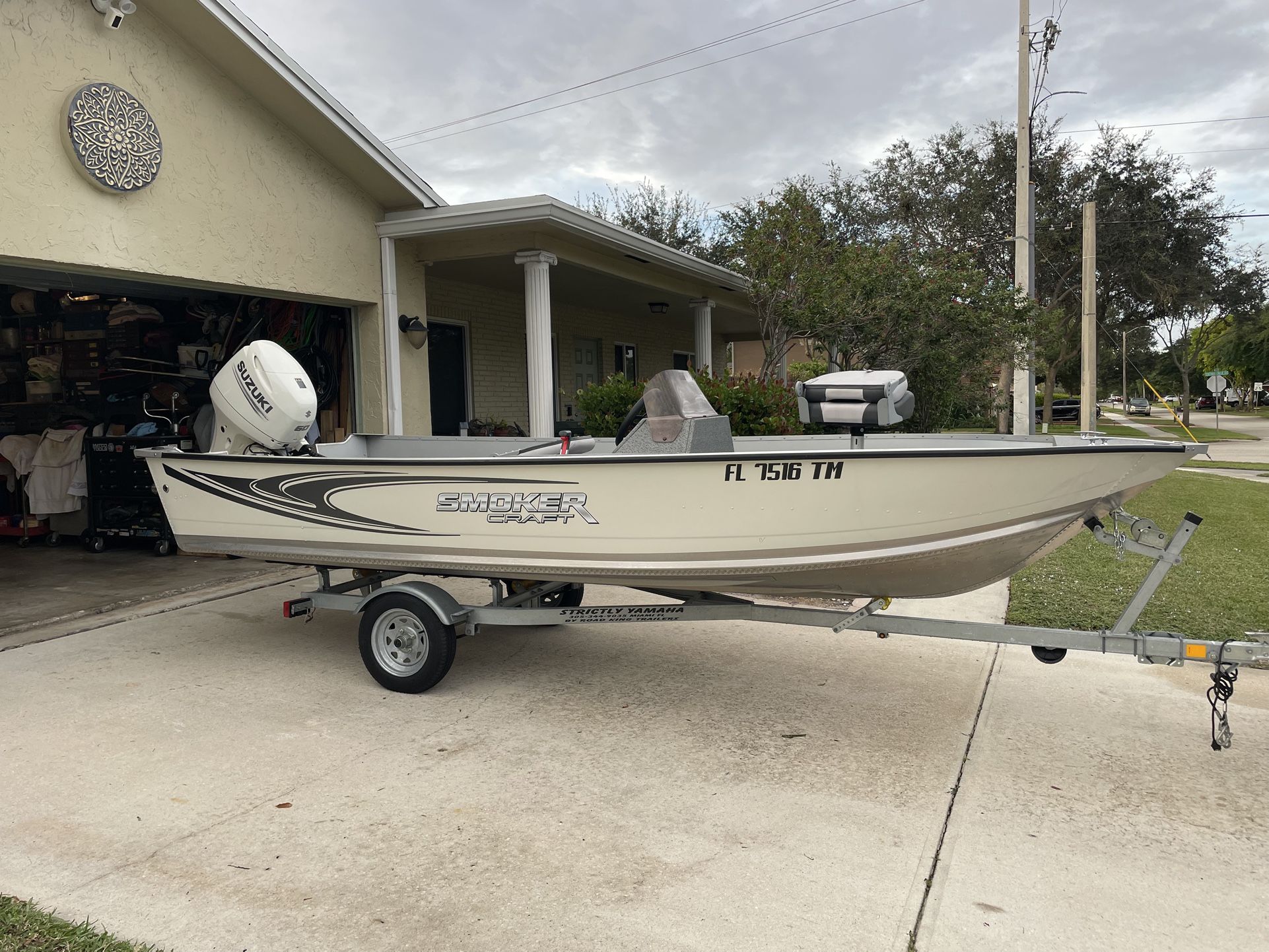 2021 16’ aluminum boat 60 HP 4 stroke Suzuki with trailer roughly 20hr of run time like new