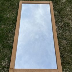 large mirror with wood frame