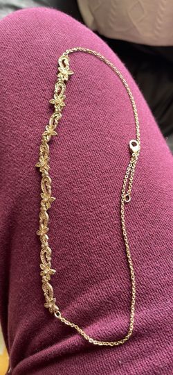 Gold colored choker necklace with rhinestones