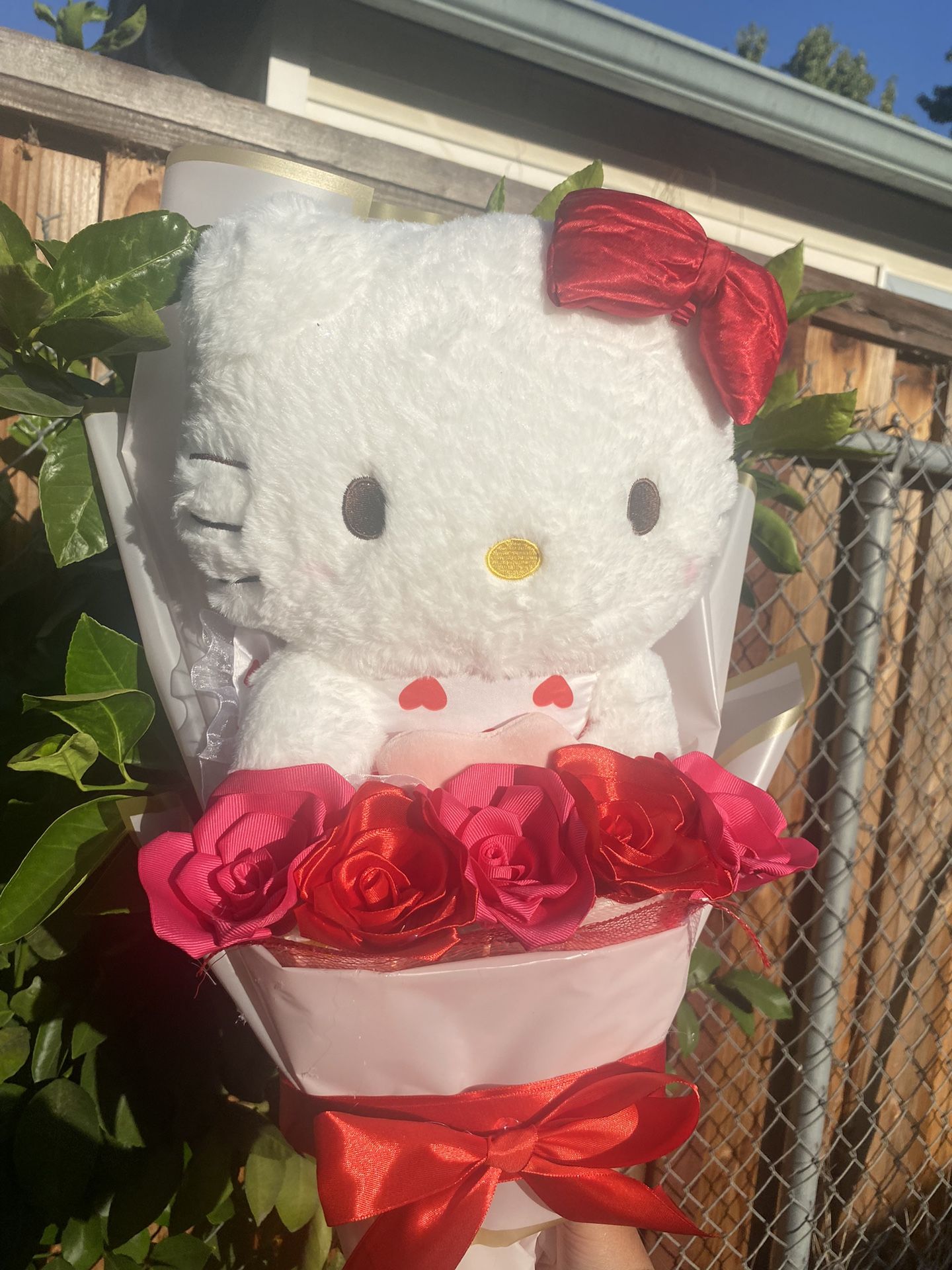 Hello kitty with big plushie and eternal roses 