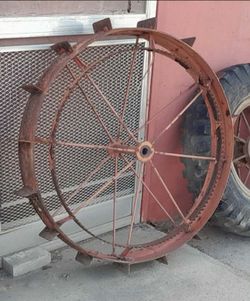 antique rusted steel tractor wheel
