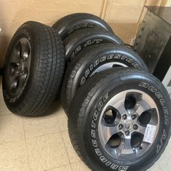 18” Bridgestone  Tires W/ Original Jeep Rims 
