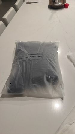 Brand new essentials hoodie size small Black with bag and tags