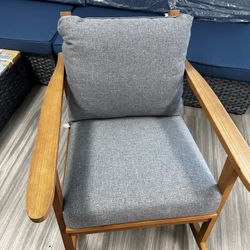 Wooden Rocker Wide Arm Chair With Gray Cushions 