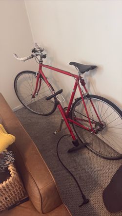 Red bike and pump for sale