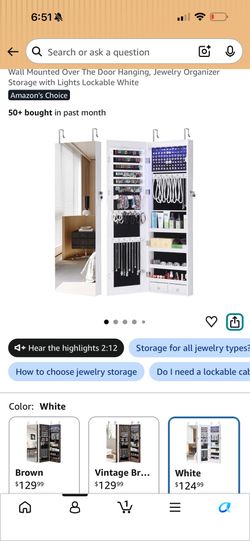 BRAND NEW from Amazon - has bowed door - lighted jewelry mirror
