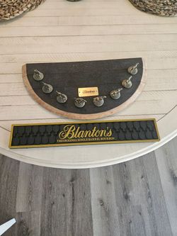 Bar Blantons mat and half barrel with collector corks that spell Blantons as a racetrack