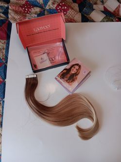 Tape in human hair extensions