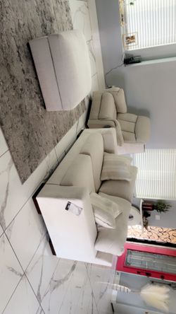 Recliner, love seat and ottoman with storage. New without box