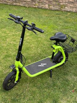 Green Electric Scooter with car seat