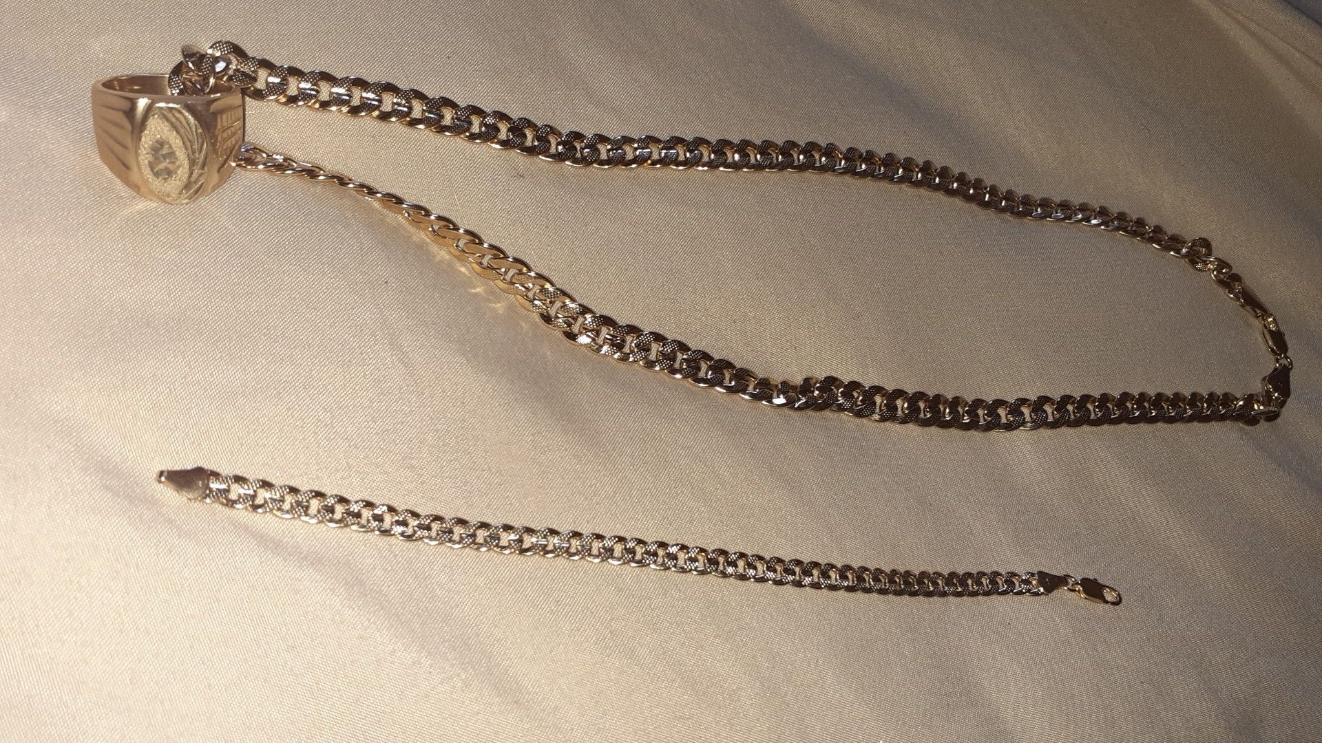 18k real gold chain ring and bracelet. ONLY SERIOUS INQUIREIES ASKING 3000 DOLLARS.