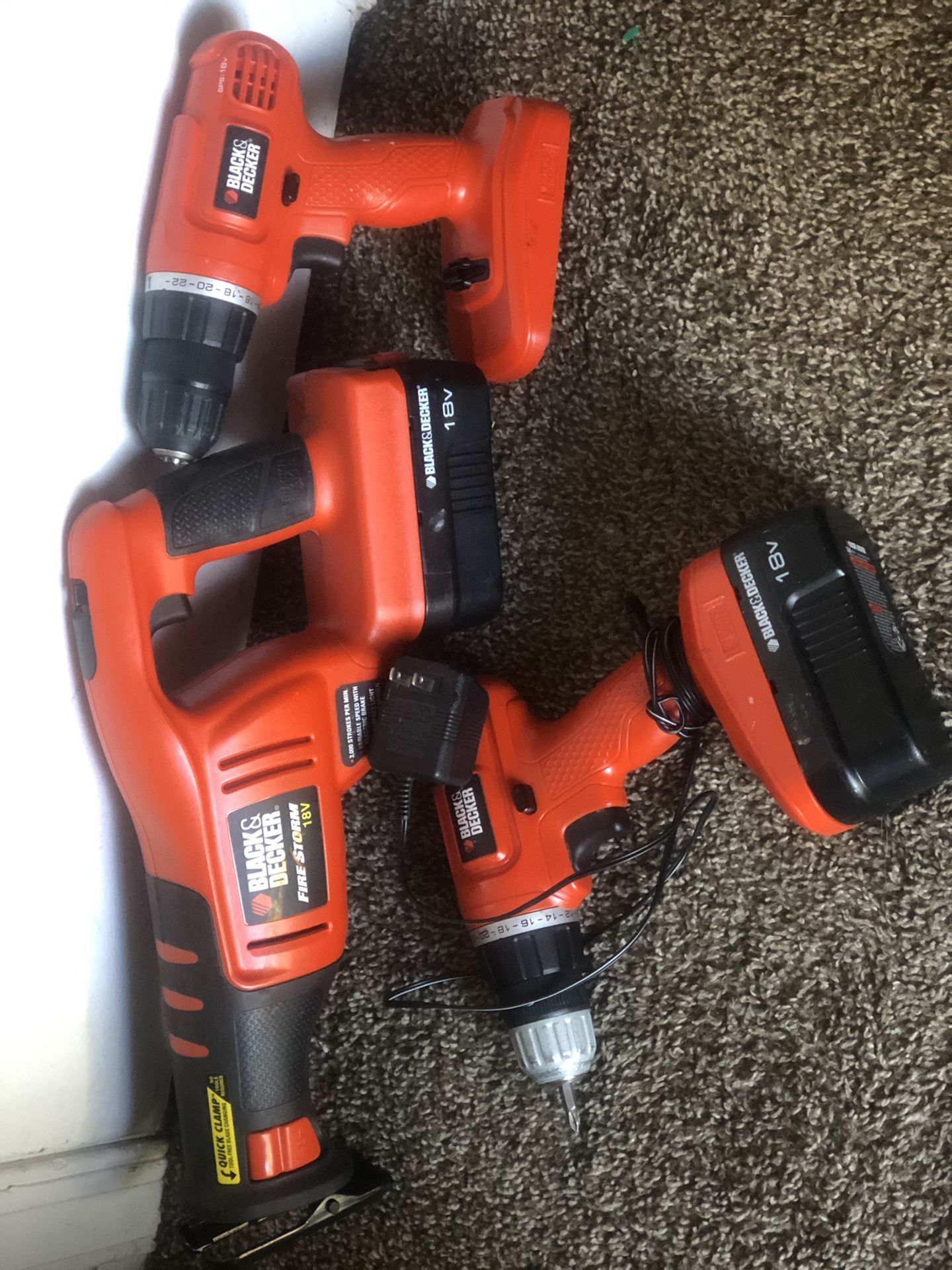 Black and decker 18 v reciprocating saw and 2 drills with charger