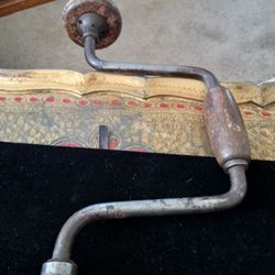 Old Hand Drill And Old Pipe Wrench. 