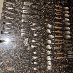 DANSK TORUN STAINLESS UTENSILS + STAINLESS UTENSILS WITH BROWN HANDLE.