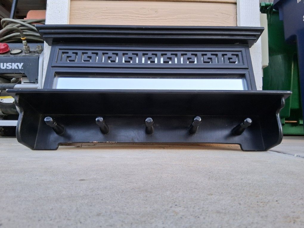 GORGEOUS MIRROR BACK SHELF with Greek Key Design, And With Coat/Hat Rack Hanger Pegs. Measures30" Wide, 18" Tall....asking $75.00