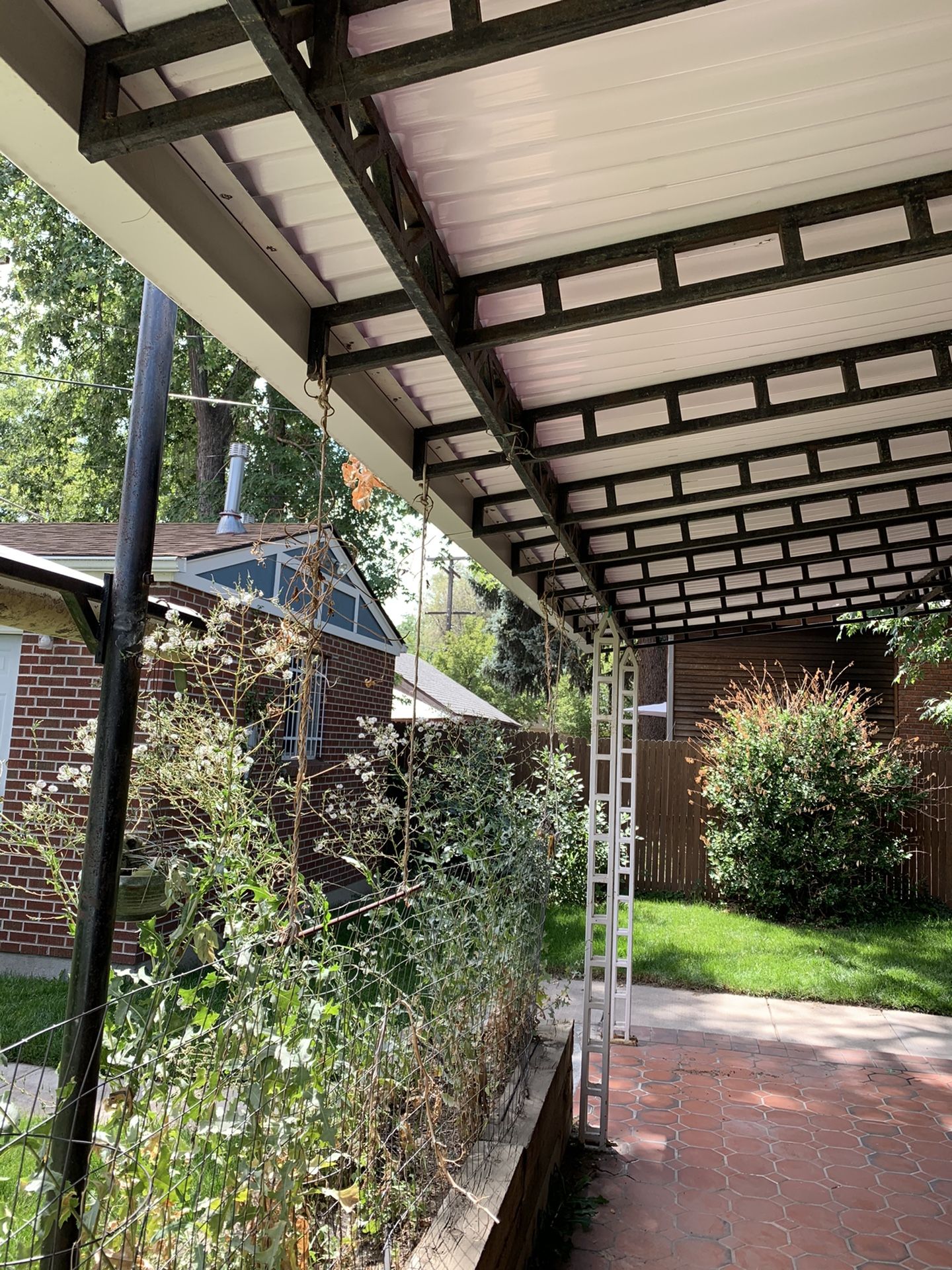 Steel back patio canopy for sale, requires assistance for removal