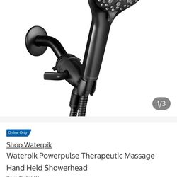 Waterpik PowerPulse handheld shower head in a matte black finish