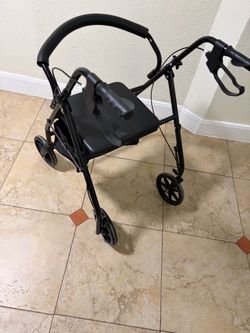 Black Four-Wheel Rollator Walker with Seat