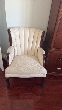 Cream wing back chair