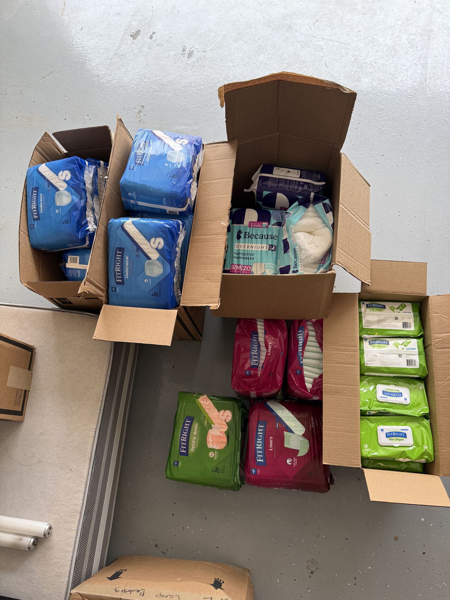 Assortment of fit right wipes and liners etc