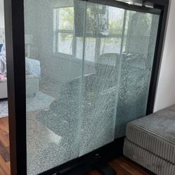 Freestanding glass partition/wall with tempered (safety) glass.