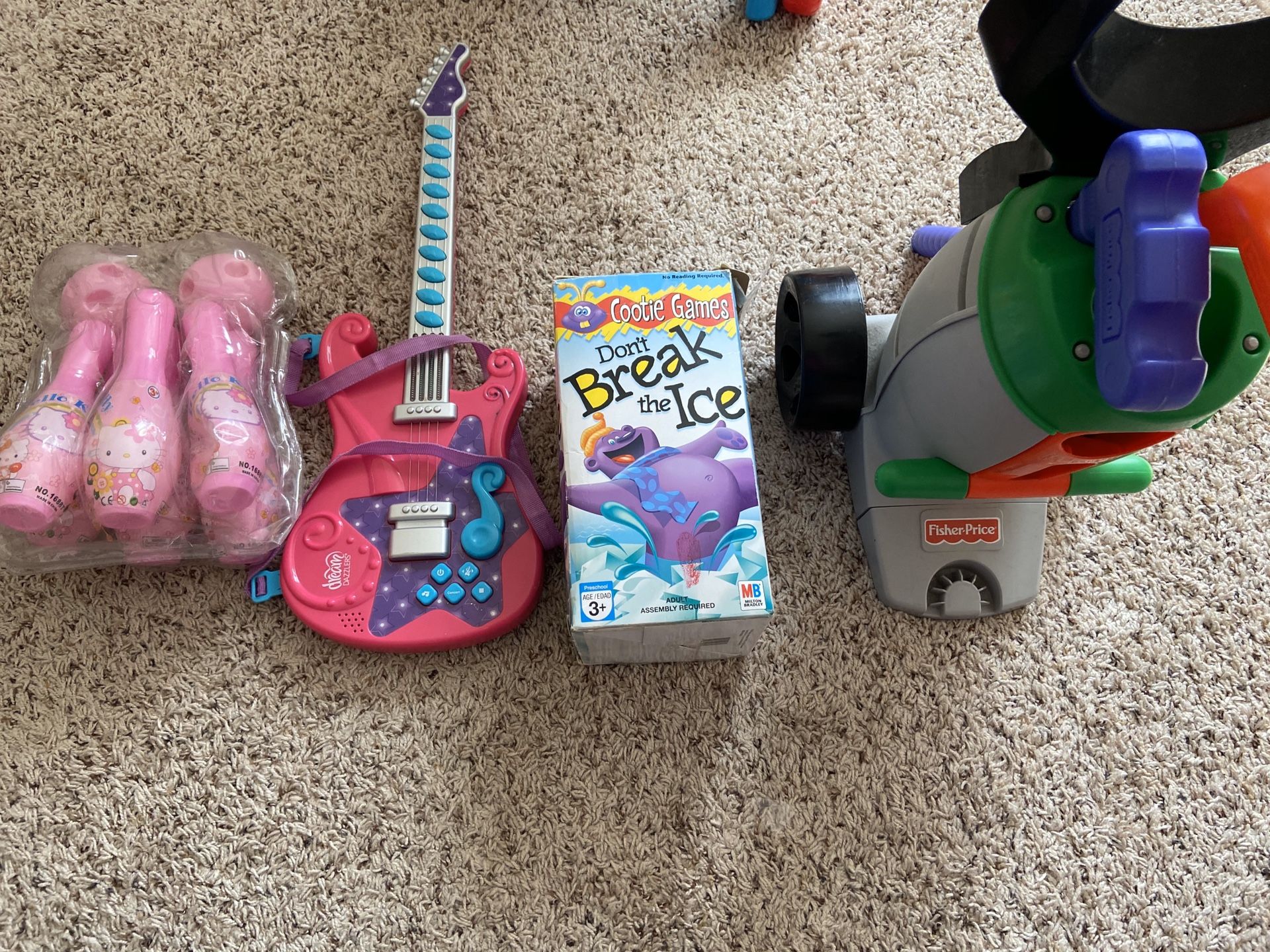 All toys for $15, fisher price golf, cootie game, guitar, bowling game