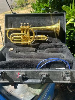 King model 603 Cornett in good condition with case and mouthpiece and some other accessories. Has small dent in the bell which is in the picture. The