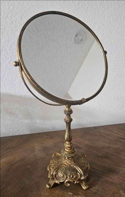 Vintage brass double sided vanity mirror with ornate floral and scrollwork detailing  #vanity