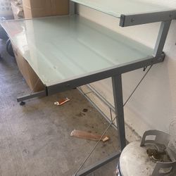 Glass desk with metal frame