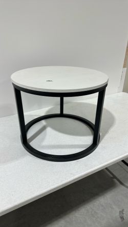 White round side table with black legs