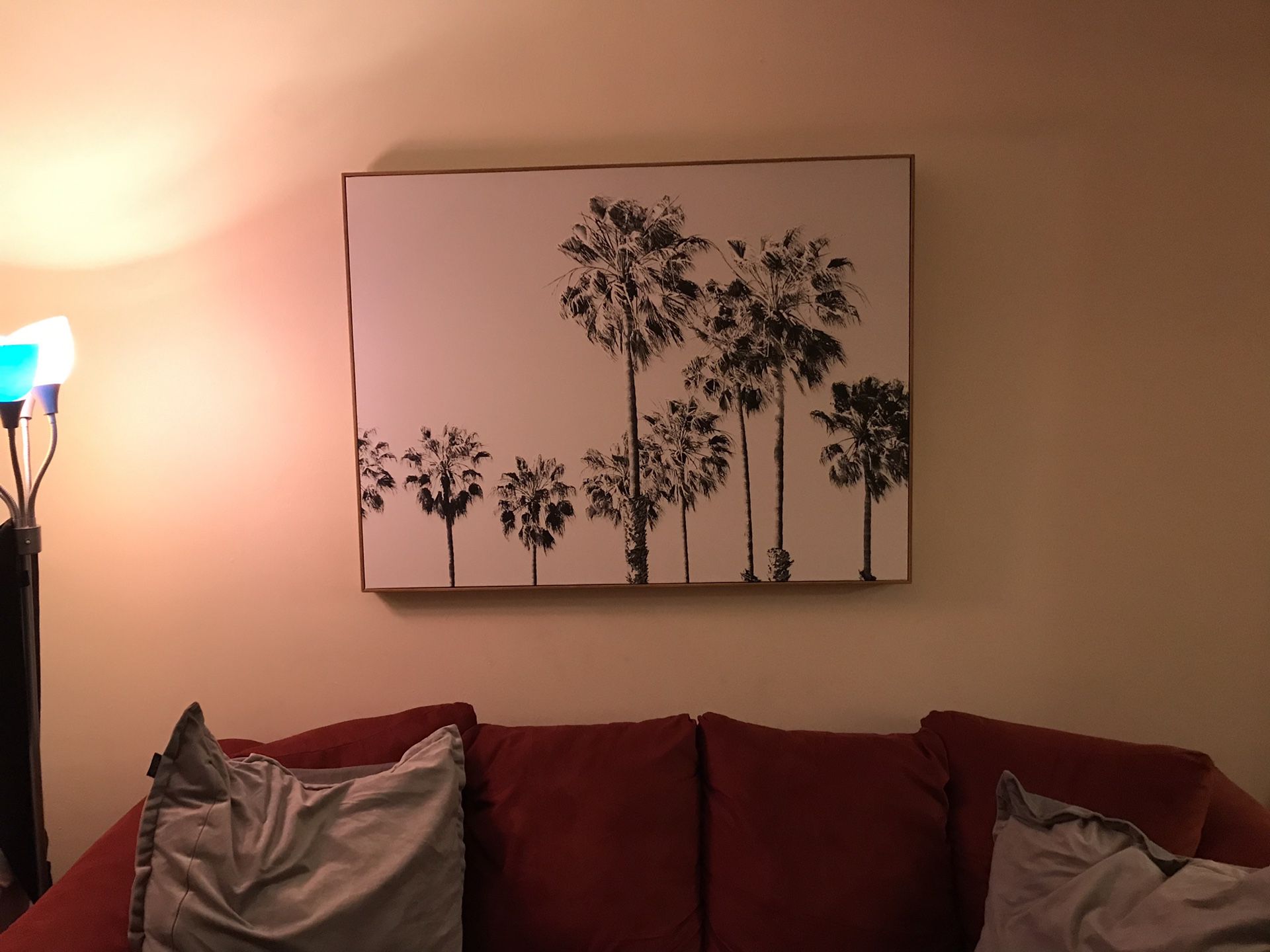 Large palm tree canvas painting with light brown wood frame