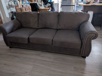 Dark green couch with nailhead trim! $200 OBO