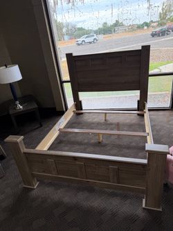 Brown wood queen bed frame