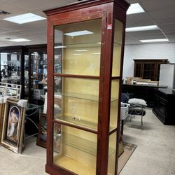Tall  curio cabinet  by Baker with a distressed red finish and glass -  Originally $3100.  - 39” x 13” x 81”