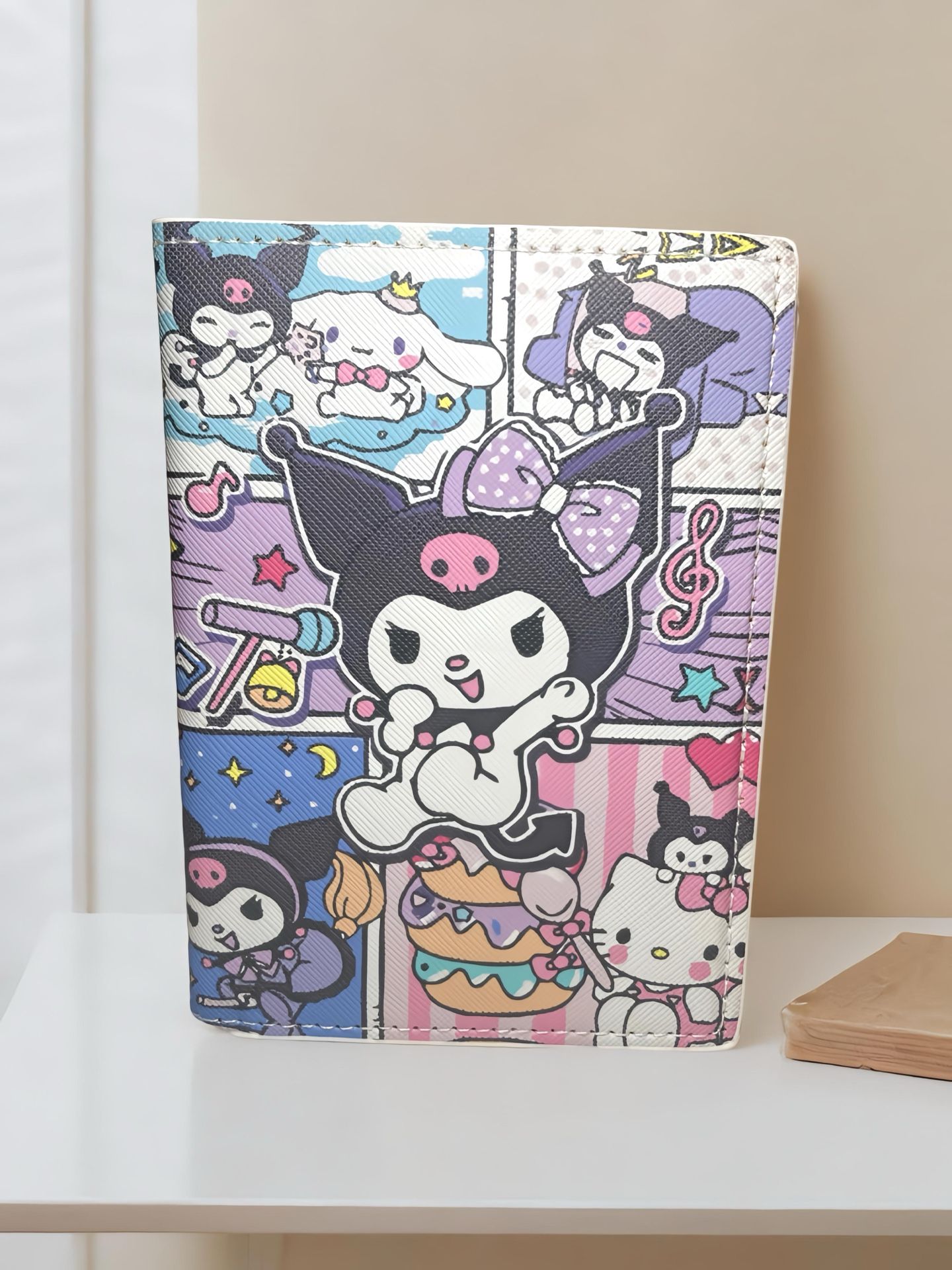 ✨ Let your travel style shine with this ultra-kawaii passport wallet featuring Kuromi, Cinnamoroll, Hello Kitty, and a swirl of sweet treats! ✨