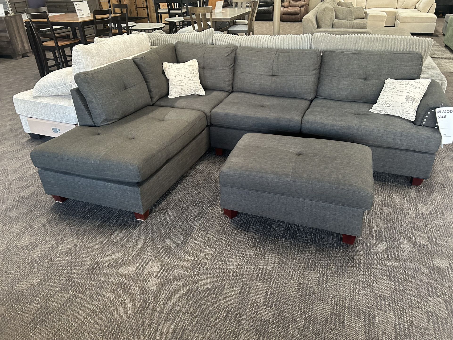 Charcoal Black Sectional And Ottoman
