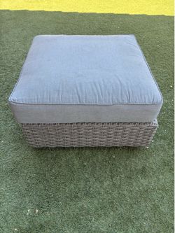 Medium gray plastic wicker ottoman