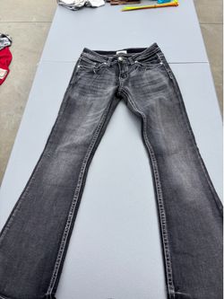 embellished black denim bootcut jeans featuring intricate rhinestone and embroidered back pocket detailing Size: 5