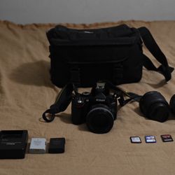 Nikon D5100 DSLR Camera with 18-55mm VR Lens, 50mm prime, and 35mm prime lenses