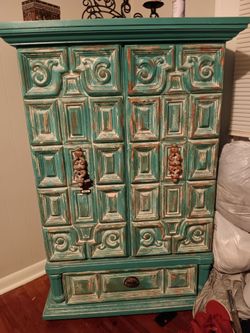 Distressed teal ornate cabinet