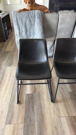 Dark brown leather dining chairs from west elm.